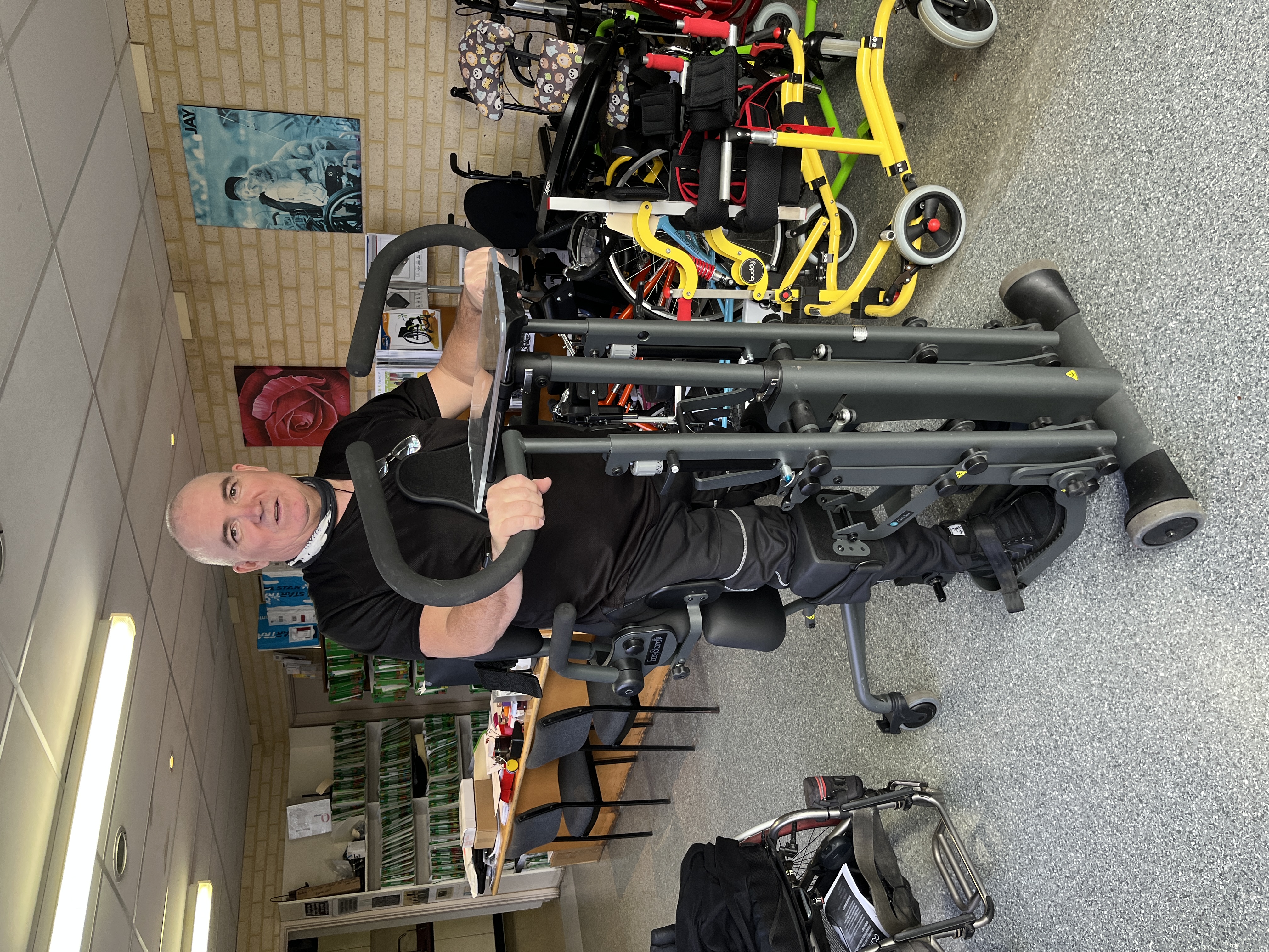 Andreas standing upright in a standing frame